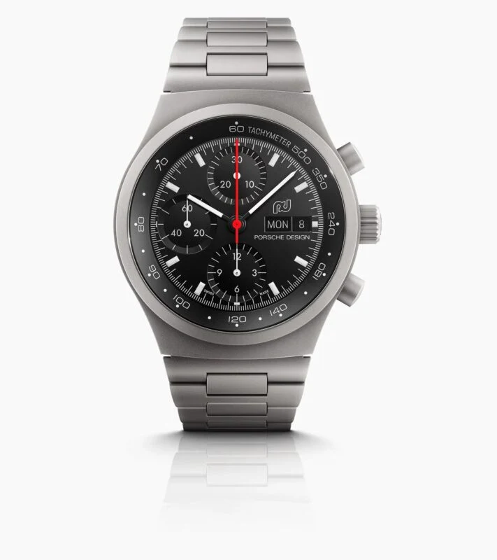 A 2025 Porsche Design stainless steel chronograph wristwatch with a black dial, three subdials, date and day display, and a metal link bracelet—an elegant choice for any Holiday Gift Guide.