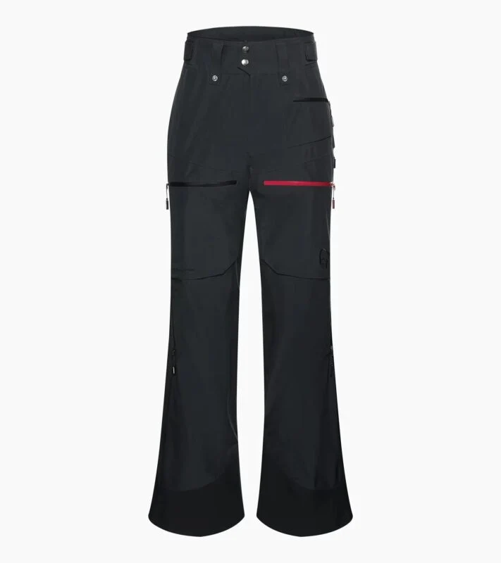 Black high-waisted utility pants with multiple pockets, zip and button closure, and a red accent zipper on the right side—an ideal Holiday Gift Guide pick for 2025 inspired by Porsche Design.