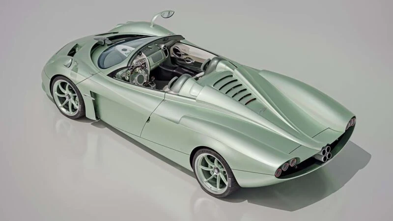 A light green, modern Pagani Automobili Speedster with a sleek, aerodynamic design, viewed from above and behind. The interior and dashboard of this Huayra Codalunga are visible.